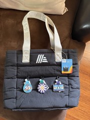 ALDI Gear 50th anniversary bundle. Two totes, a pullover, and 3 quarter holders.