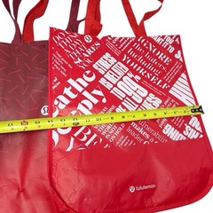 Three red and white lululemon reusable tote bags 16 x 14 inches