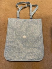 Lululemon reusable small ligh blue logo shopping tote bag with button closure