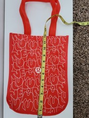 Lululemon Small Logo Reusable Shoppers Bag Red w/ logos all over front and back.