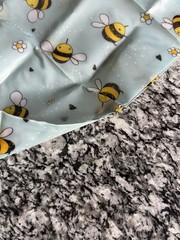 Wrapables Polyester reusable shopping bag With a cheerful bumble bee pattern.