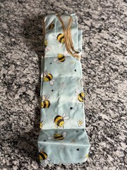 Wrapables Polyester reusable shopping bag With a cheerful bumble bee pattern.
