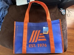 ALDI Gear 50th anniversary bundle. Two totes, a pullover, and 3 quarter holders.
