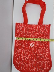 Lululemon Small Logo Reusable Shoppers Bag Red w/ logos all over front and back.