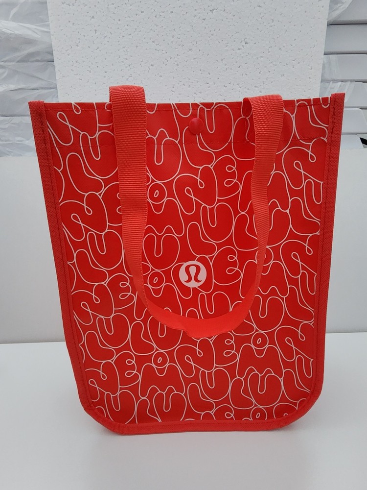 Lululemon Small Logo Reusable Shoppers Bag Red w/ logos all over front and back.